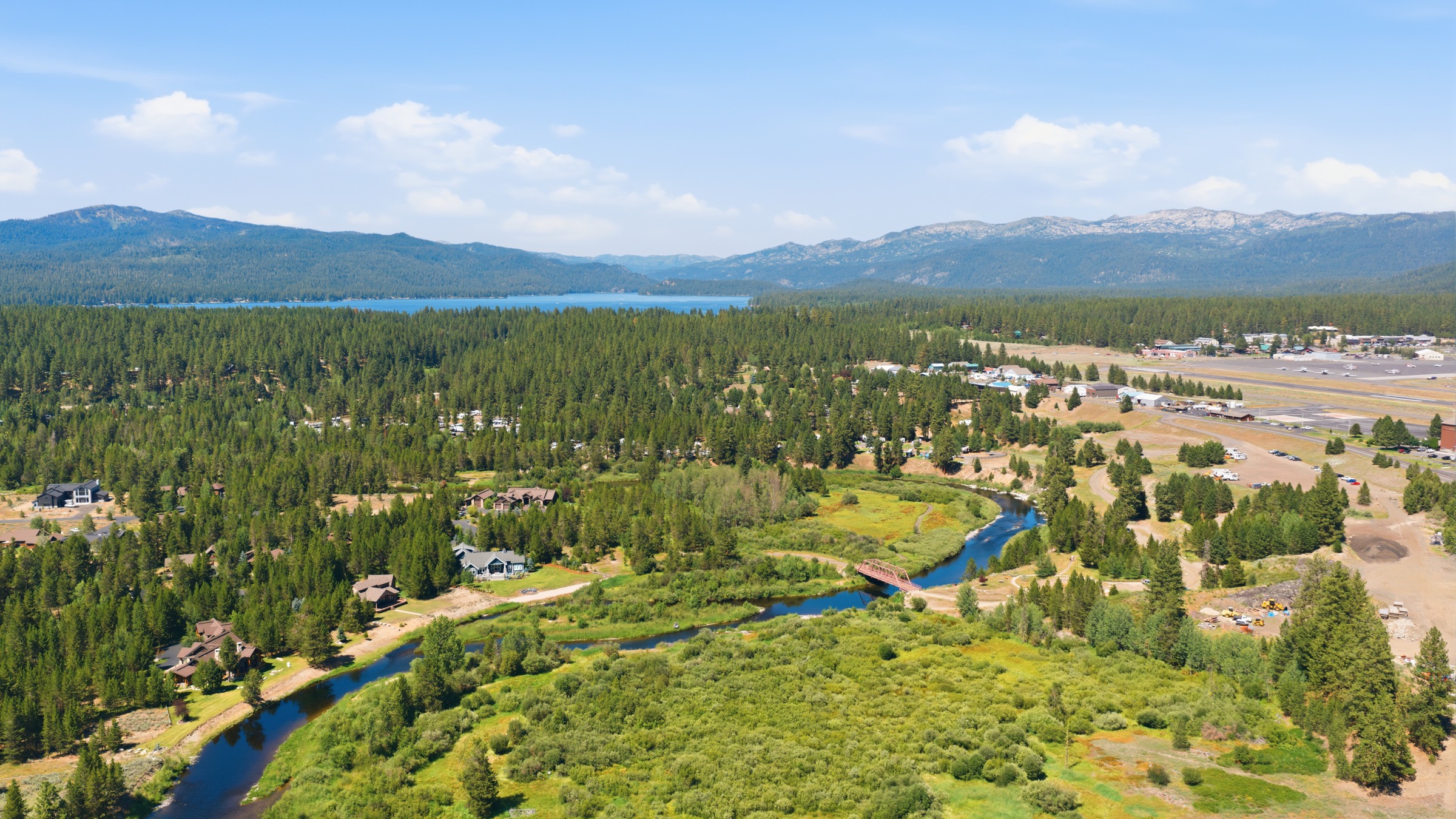 Aerial drone view of a property and surrounding landscape